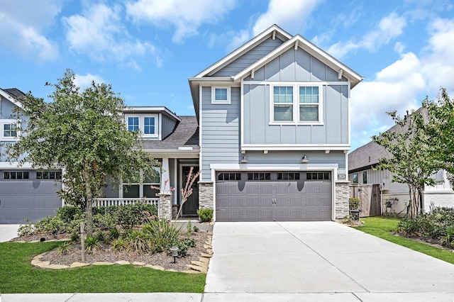 11826 Tranquility Summit Dr, Cypress, TX 77433 - craftsman-style home featuring stone siding, board and batten siding, driveway, and an attached garage
