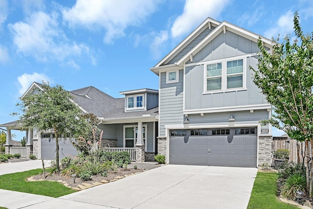 11826 Tranquility Summit Dr, Cypress, TX 77433 - craftsman house with board and batten siding, stone siding, and driveway