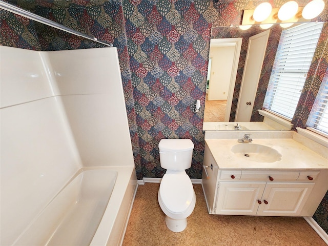 7910 Woodway Dr, Houston, TX 77063 - full bathroom with toilet, vanity, and baseboards