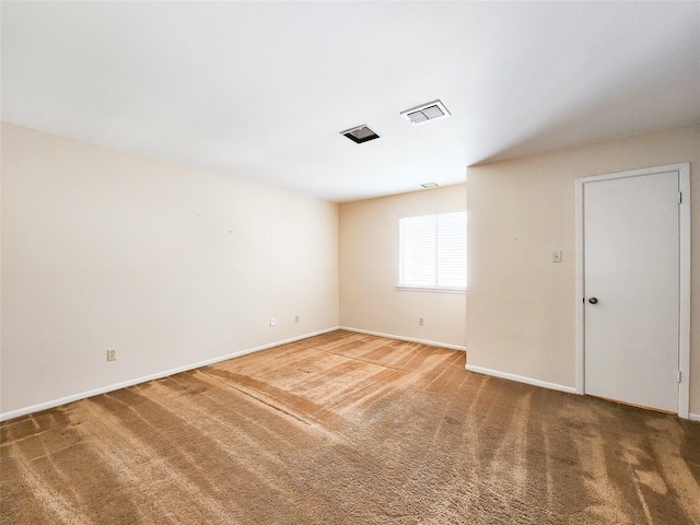 7910 Woodway Dr, Houston, TX 77063 - spare room with baseboards and light colored carpet
