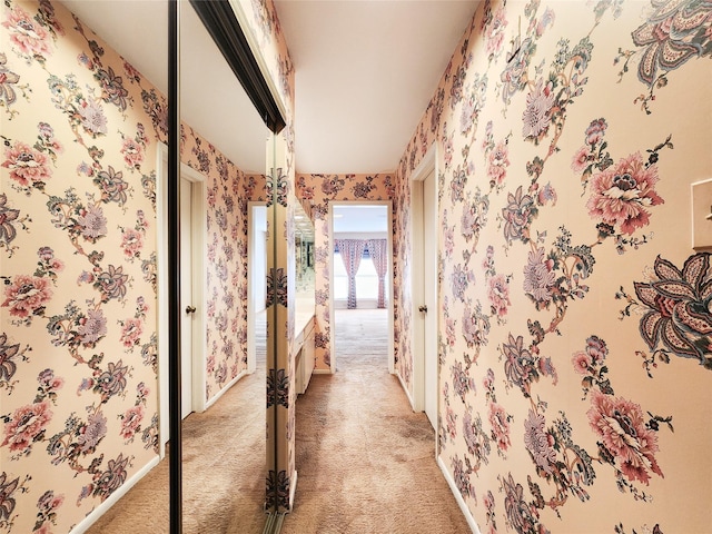 7910 Woodway Dr, Houston, TX 77063 - corridor with wallpapered walls and light colored carpet