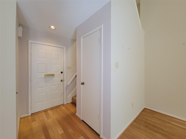 7910 Woodway Dr, Houston, TX 77063 - corridor featuring light wood-type flooring, recessed lighting, and baseboards