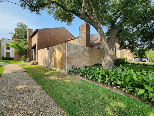 7910 Woodway Dr, Houston, TX 77063 - view of property exterior featuring a chimney