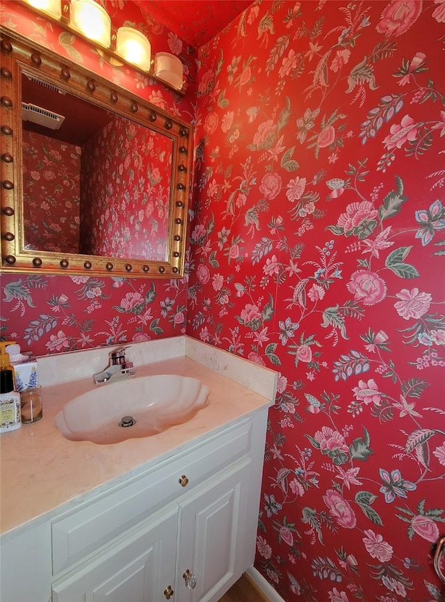 7910 Woodway Dr, Houston, TX 77063 - bathroom with wallpapered walls and vanity