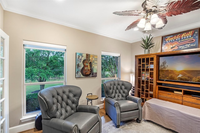 3315 E Bayou Dr, Shoreacres, TX 77571 - bedroom featuring crown molding, wood finished floors, multiple windows, and a ceiling fan