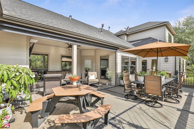 3315 E Bayou Dr, Shoreacres, TX 77571 - wooden deck featuring outdoor dining space and a ceiling fan