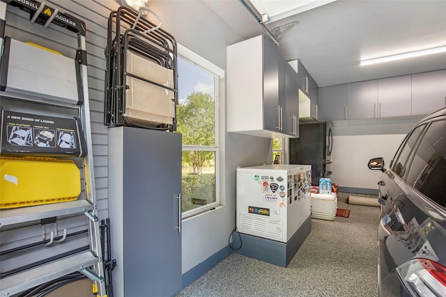 3315 E Bayou Dr, Shoreacres, TX 77571 - garage featuring freestanding refrigerator