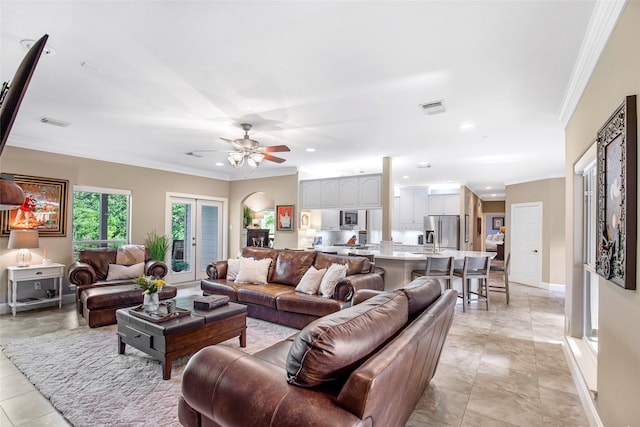 3315 E Bayou Dr, Shoreacres, TX 77571 - living area with ornamental molding, ceiling fan, recessed lighting, and light tile patterned flooring