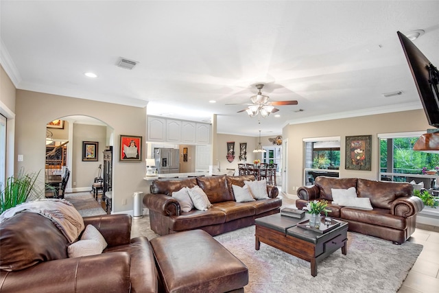 3315 E Bayou Dr, Shoreacres, TX 77571 - living room with arched walkways, a ceiling fan, crown molding, recessed lighting, and light tile patterned floors