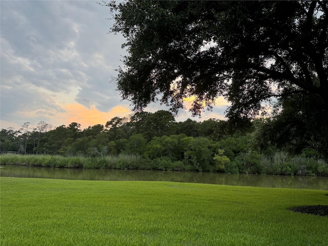 3315 E Bayou Dr, Shoreacres, TX 77571 - yard at dusk with a water view and a yard