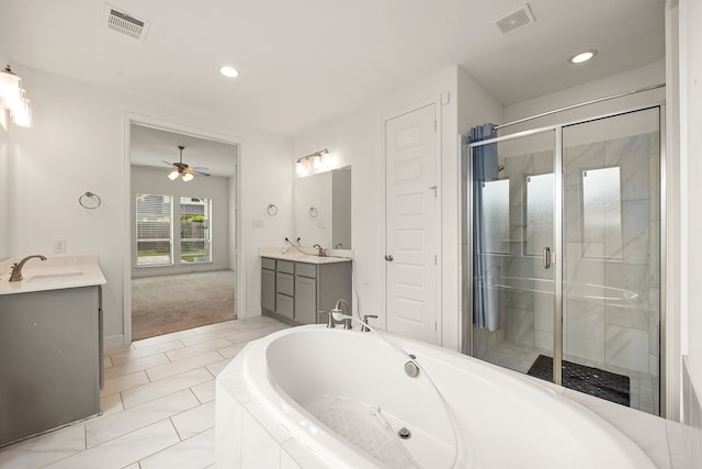 28946 Parker Ridge Dr, Katy, TX 77494 - full bathroom featuring vanity, a bath, a shower stall, ceiling fan, and recessed lighting