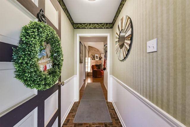 12938 Dermott Dr, Houston, TX 77065 - hallway with brick patterned flooring and wallpapered walls