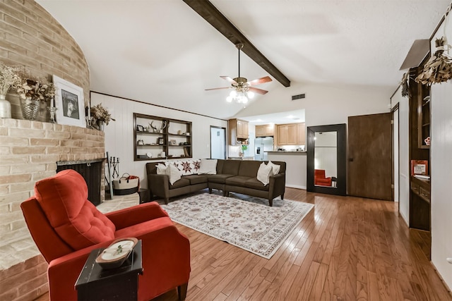 12938 Dermott Dr, Houston, TX 77065 - living area featuring a brick fireplace, hardwood / wood-style floors, and ceiling fan