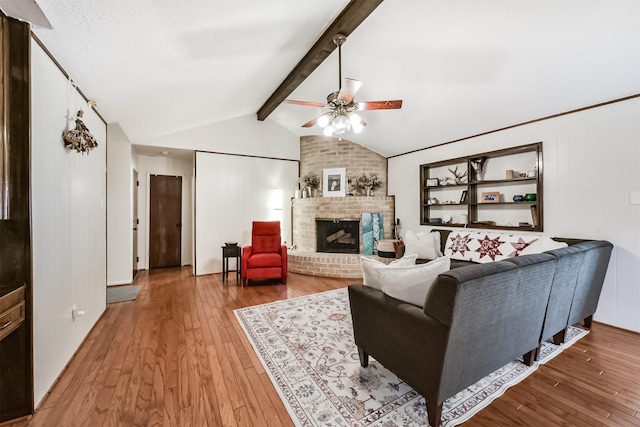 12938 Dermott Dr, Houston, TX 77065 - living room featuring ceiling fan, light wood-type flooring, and a fireplace