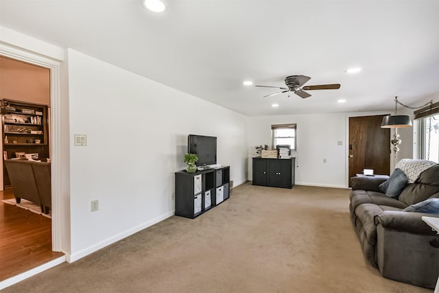 12938 Dermott Dr, Houston, TX 77065 - living room with ceiling fan, recessed lighting, baseboards, and light colored carpet