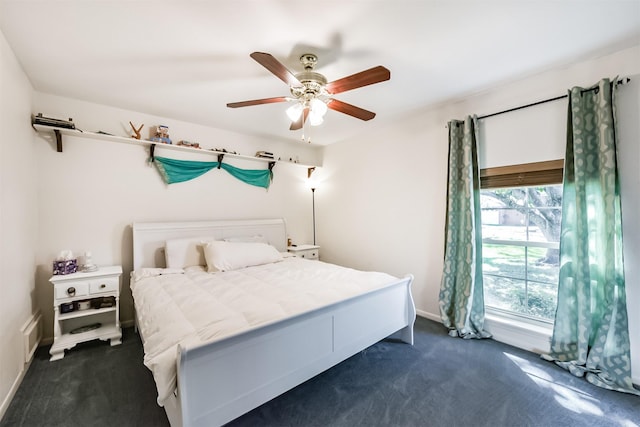 12938 Dermott Dr, Houston, TX 77065 - bedroom featuring dark colored carpet, baseboards, and ceiling fan