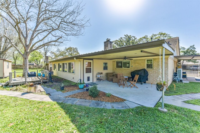 12938 Dermott Dr, Houston, TX 77065 - rear view of property with a ceiling fan, a chimney, a yard, a deck, and a patio
