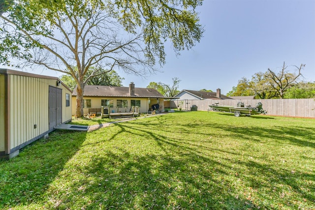 12938 Dermott Dr, Houston, TX 77065 - view of yard featuring an outdoor hangout area and an outbuilding