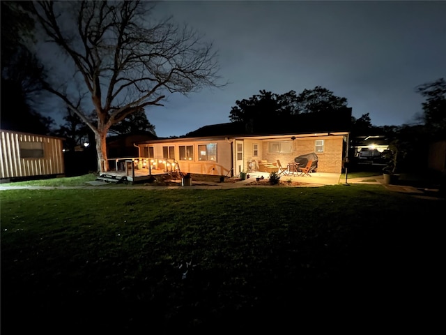 12938 Dermott Dr, Houston, TX 77065 - back of house at night with a deck