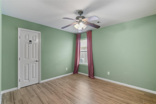 14925 Cypress Ridge Grove Ln, Cypress, TX 77429 - unfurnished room featuring light wood-style floors, a ceiling fan, and baseboards