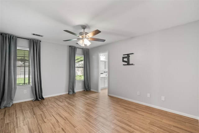 14925 Cypress Ridge Grove Ln, Cypress, TX 77429 - spare room with light wood-type flooring, a ceiling fan, and baseboards