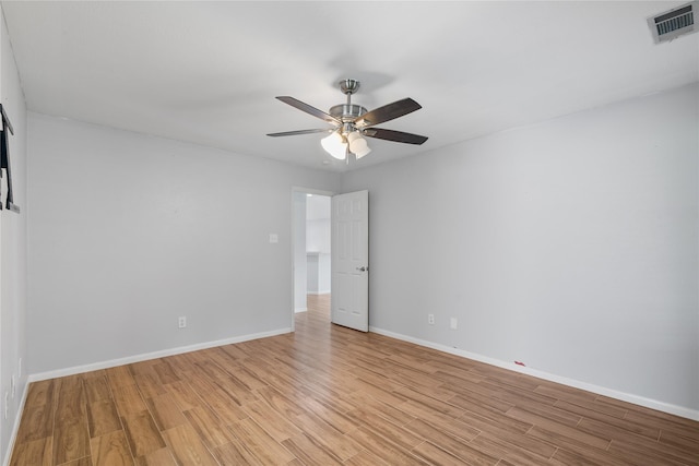 14925 Cypress Ridge Grove Ln, Cypress, TX 77429 - empty room with light wood finished floors, ceiling fan, and baseboards