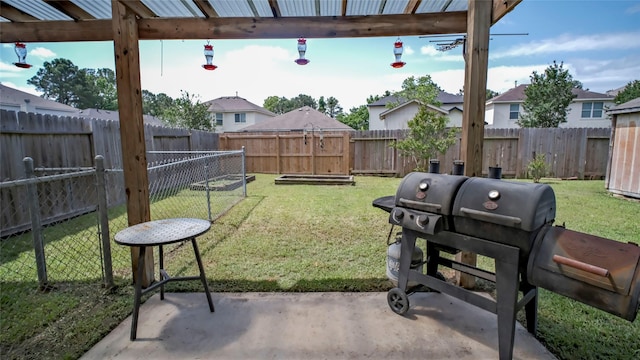 view of yard featuring a patio and a residential view