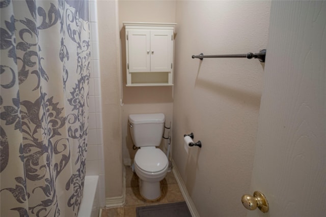 full bath with toilet and tile patterned flooring