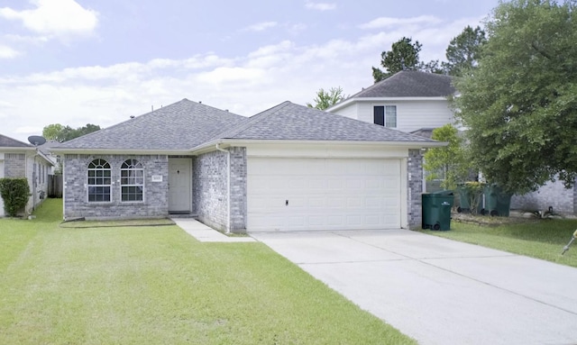 view of front of home featuring roof with shingles, a garage, concrete driveway, a front lawn, and brick siding