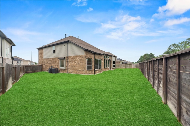 2411 Jitterbug Ln, Katy, TX 77493 - rear view of house with brick siding and cooling unit