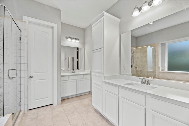 2411 Jitterbug Ln, Katy, TX 77493 - full bathroom featuring a shower stall and two vanities