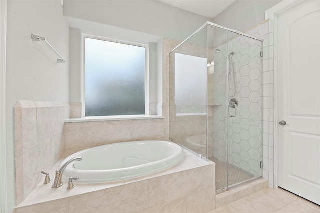 2411 Jitterbug Ln, Katy, TX 77493 - bathroom with a bath, a shower stall, and tile patterned flooring