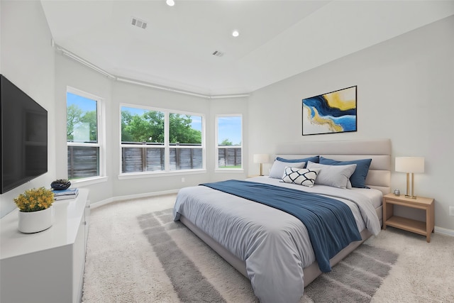 2411 Jitterbug Ln, Katy, TX 77493 - bedroom with multiple windows, light carpet, baseboards, and recessed lighting