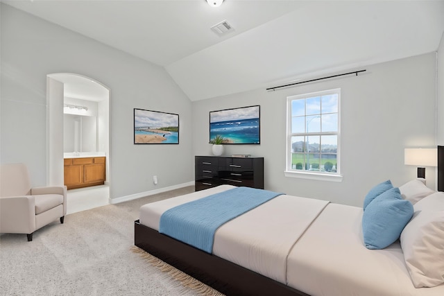 2411 Jitterbug Ln, Katy, TX 77493 - bedroom with light carpet, lofted ceiling, baseboards, and ensuite bathroom