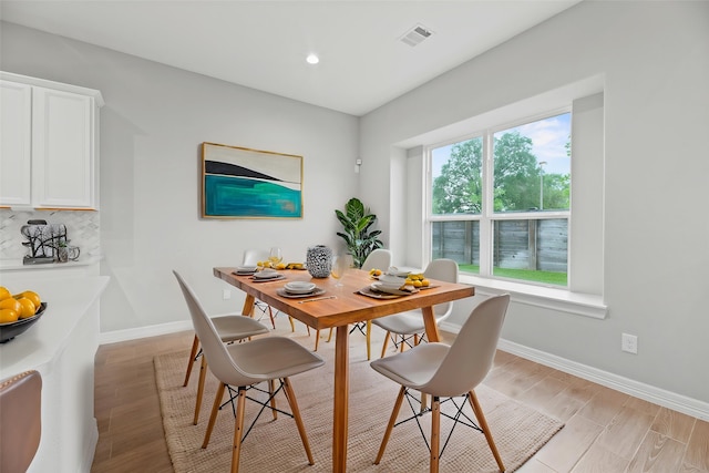 2411 Jitterbug Ln, Katy, TX 77493 - dining space with baseboards, light wood-type flooring, and recessed lighting
