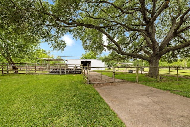 6825 Highland Rd, Santa Fe, TX 77517 - view of yard with an exterior structure and an outdoor structure