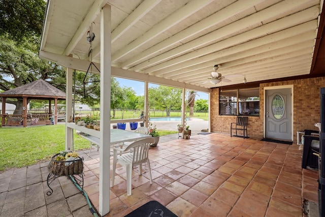 6825 Highland Rd, Santa Fe, TX 77517 - view of patio / terrace featuring a gazebo, ceiling fan, and outdoor dining area