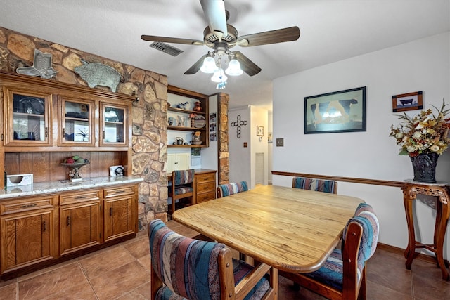 6825 Highland Rd, Santa Fe, TX 77517 - dining area with a ceiling fan and light tile patterned floors
