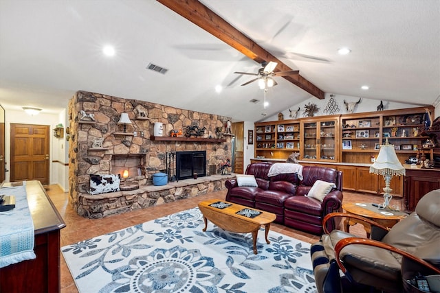 6825 Highland Rd, Santa Fe, TX 77517 - tiled living area with a stone fireplace, ceiling fan, and a textured ceiling