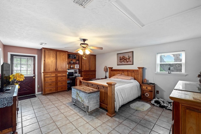 6825 Highland Rd, Santa Fe, TX 77517 - bedroom with light tile patterned floors, a textured ceiling, a desk, and ceiling fan
