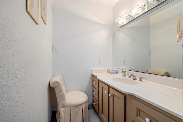 6825 Highland Rd, Santa Fe, TX 77517 - bathroom featuring vanity and a textured wall