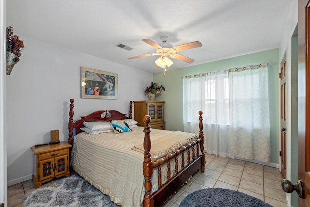 6825 Highland Rd, Santa Fe, TX 77517 - bedroom with light tile patterned flooring, baseboards, and ceiling fan