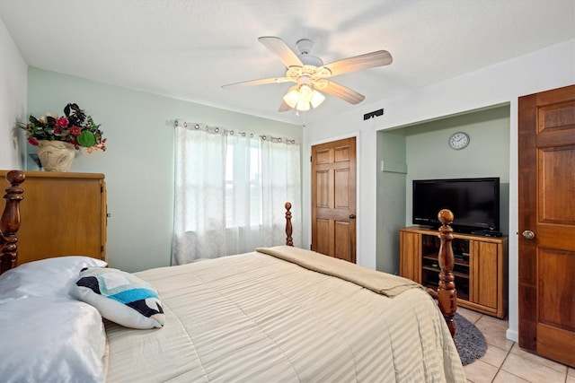 6825 Highland Rd, Santa Fe, TX 77517 - bedroom with light tile patterned flooring and a ceiling fan