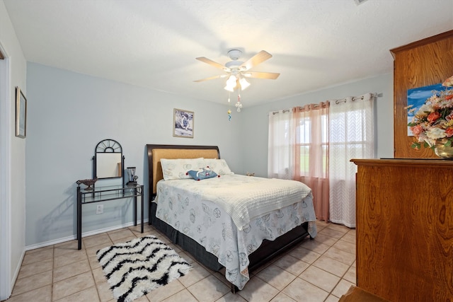 6825 Highland Rd, Santa Fe, TX 77517 - bedroom with light tile patterned floors and a ceiling fan