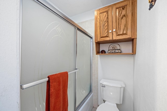 6825 Highland Rd, Santa Fe, TX 77517 - bathroom featuring toilet and shower / bath combination with glass door