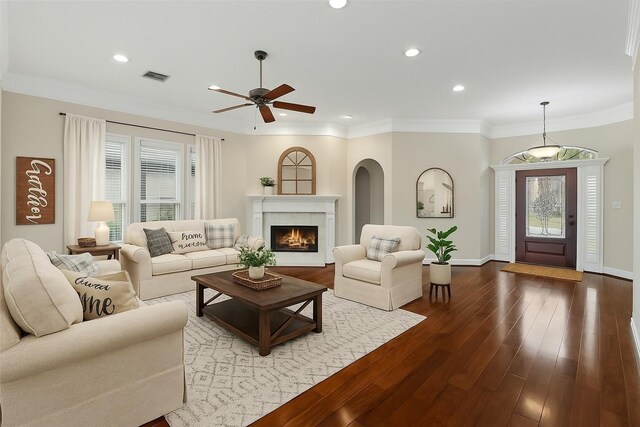 living room featuring a ceiling fan, wood-type flooring, recessed lighting, a fireplace, and baseboards