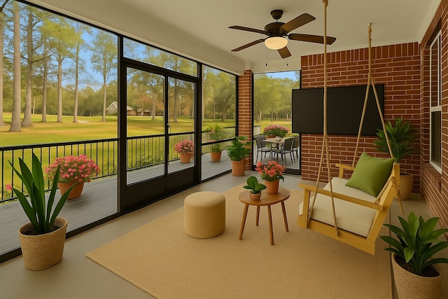 sunroom / solarium with a ceiling fan