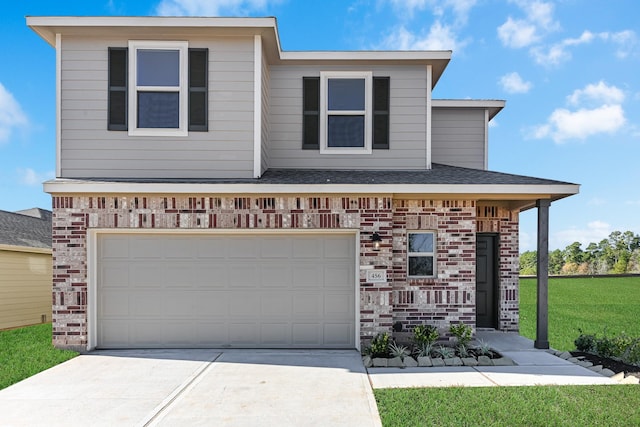 view of front facade featuring driveway, a garage, a front lawn, and brick siding