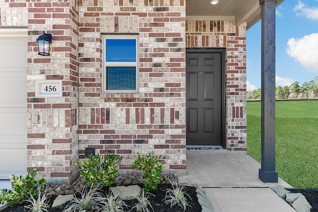 entrance to property with brick siding