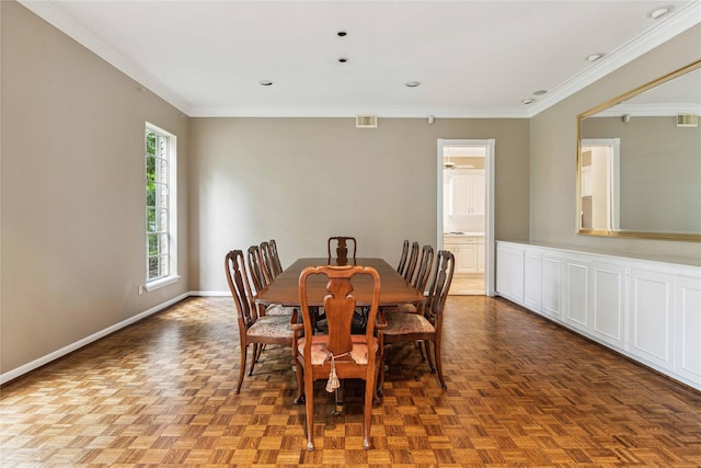 dining room featuring ornamental molding, baseboards, and recessed lighting